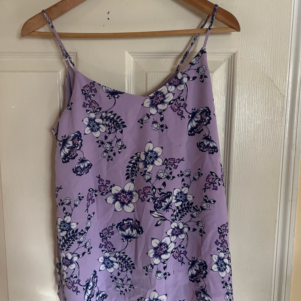 I am selling a purple medium size camisole top with flowers for $10.